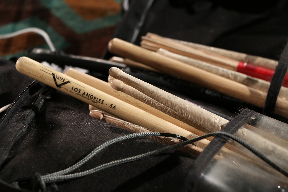 Closeup of drumsticks at the Blackie and the Rodeo Kings concert